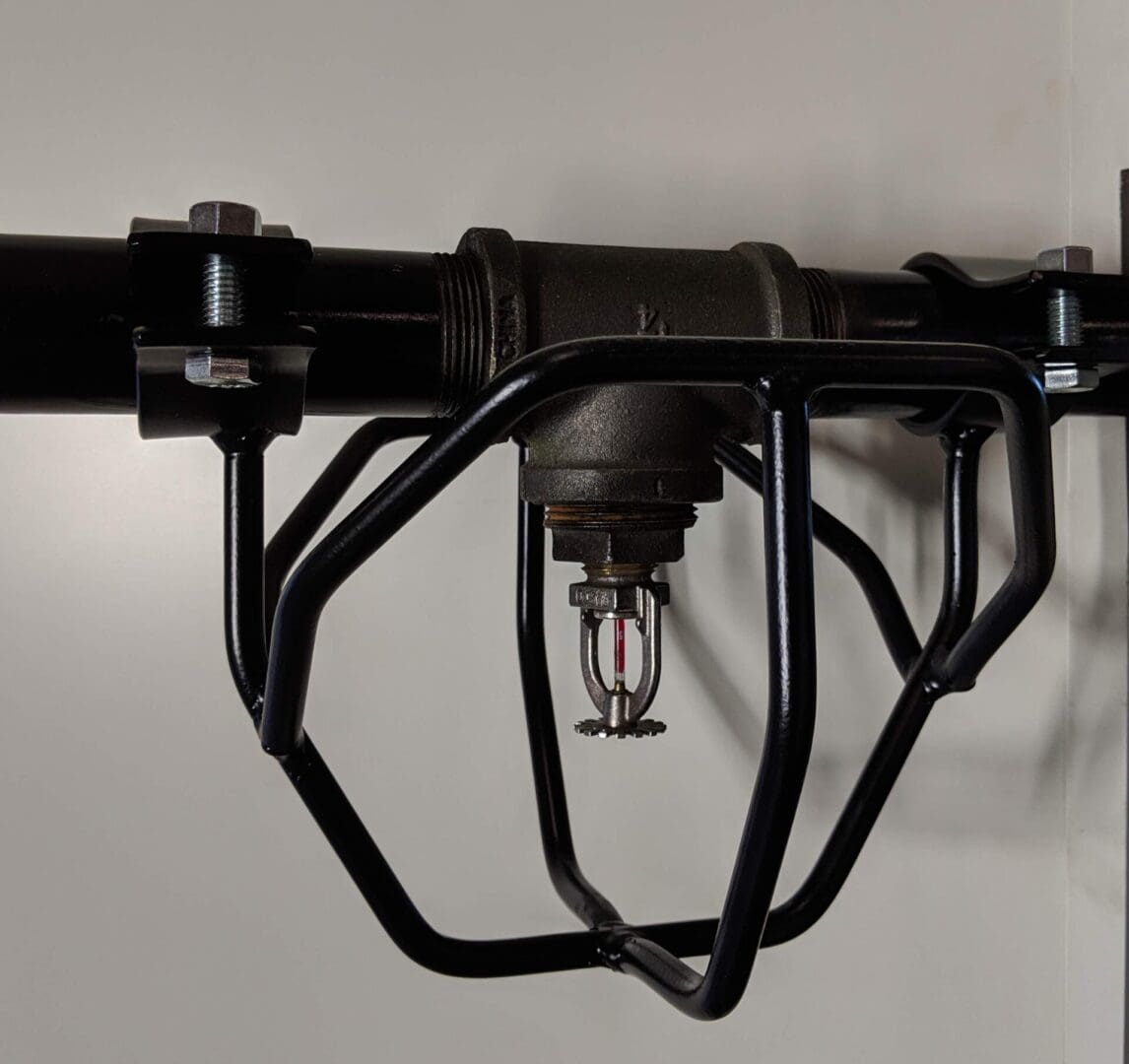 A black bicycle frame hanging on the wall.