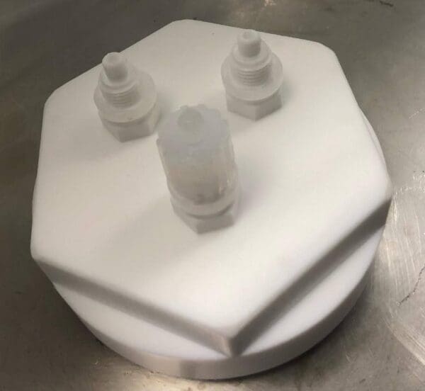 A white plastic container sitting on top of a table.