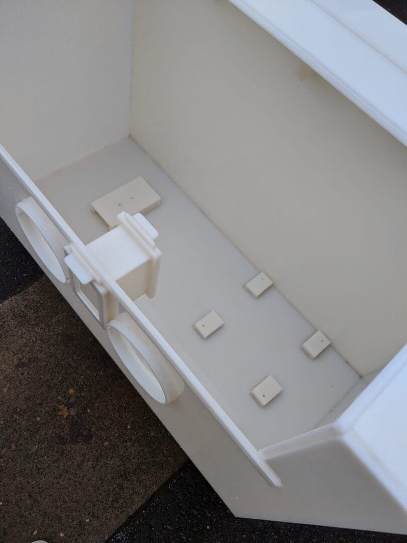 A white bathroom with a toilet and sink.