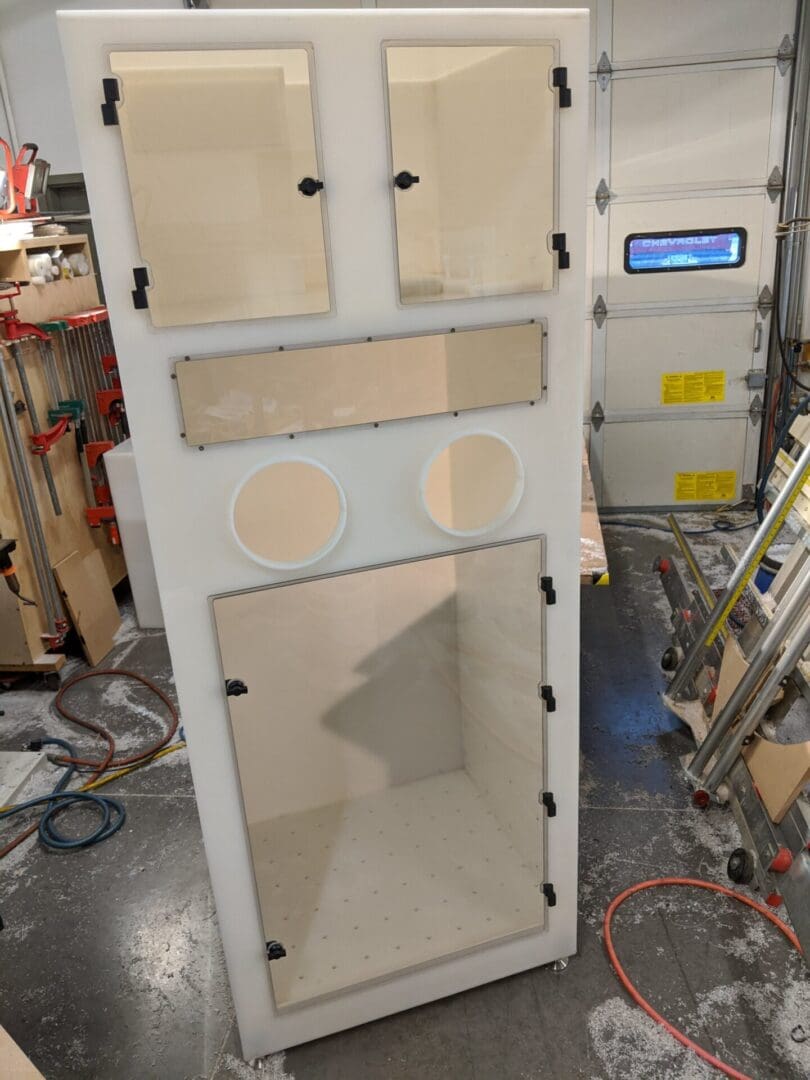 A white cabinet with some holes in it