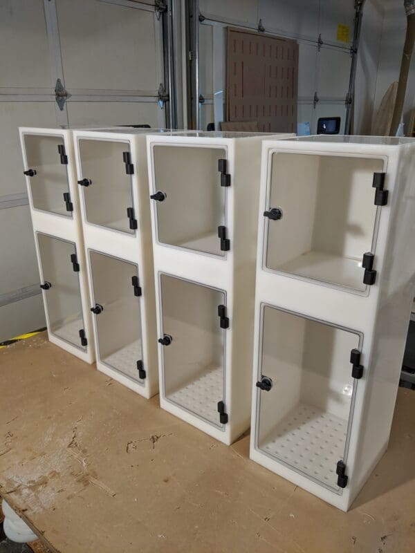 A group of white cabinets sitting on top of a floor.