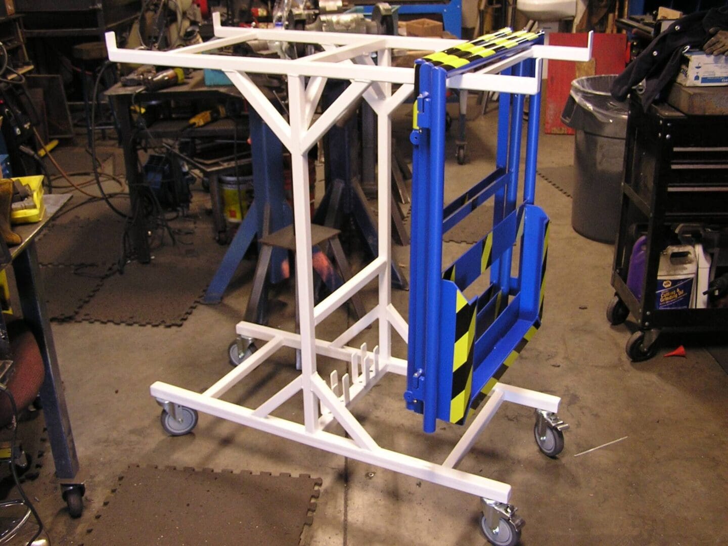 A cart with a blue and yellow rack on it.